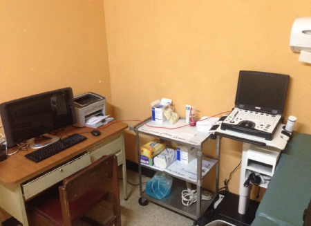 a corner of a room showing a mini-PACS and ultrasound system