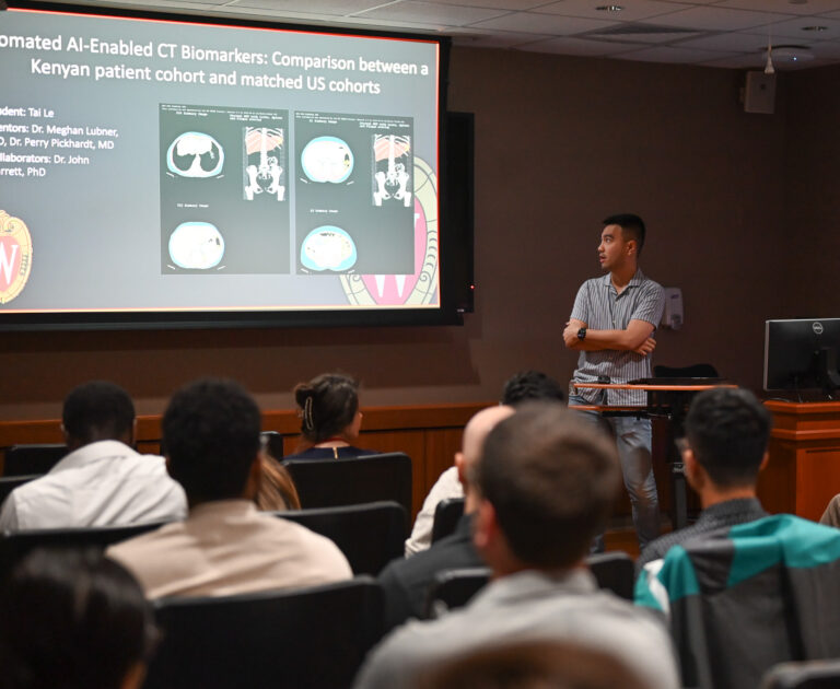 Tai Le presents his summer research project to radiology faculty and trainees.