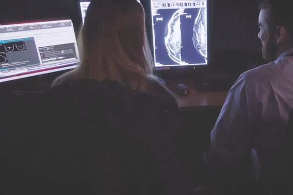 Inside look at colleagues collaborating in the reading room.
