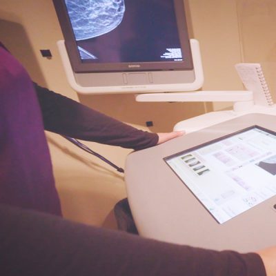 Patient standing on using medical equipment.