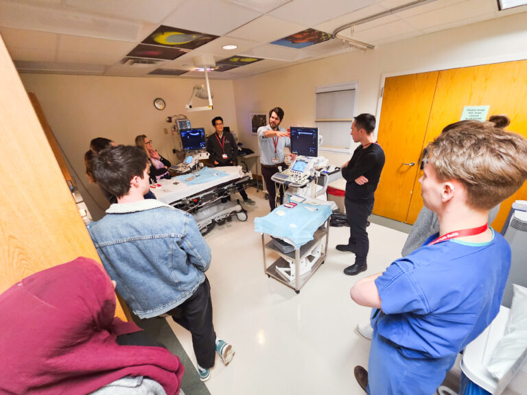 Students and faculty members at the ultrasound station.