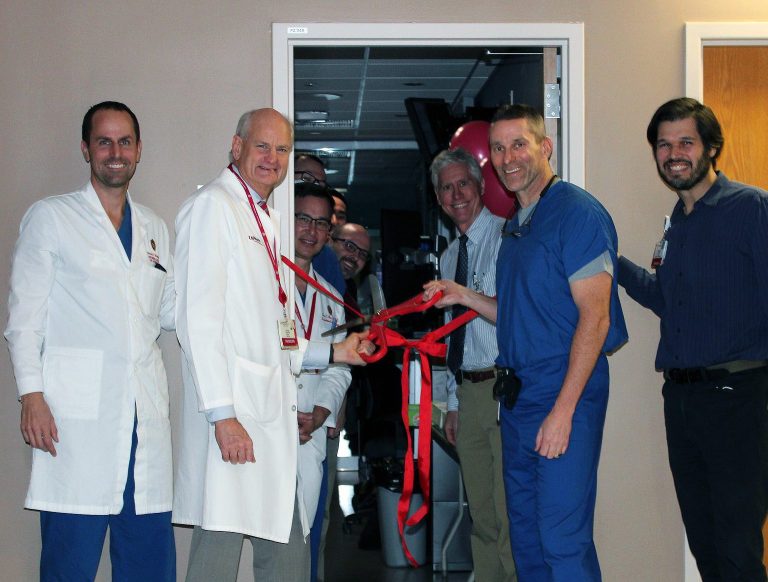 (Left to Right) Michael Hartung, MD; Thomas Grist, MD; J. Louis Hinshaw, MD; and Giuseppe Toia, MD cutting the ribbon at the grand opening of the reading room.