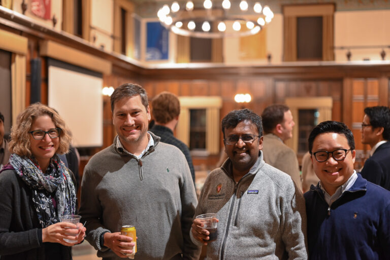 Faculty members smiling