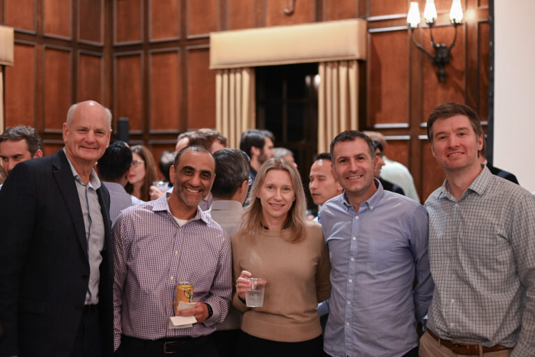 Faculty members smiling