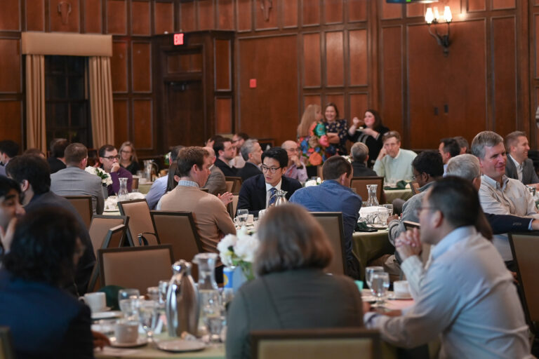Faculty members sitting down