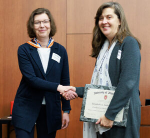 Cherri Hobgood, MD presents Elizabeth Sadowski, MD with the Excellence in Mentorship Award at the GWIMS symposium. From left to right, Dr. Hobgood and Dr. Sadowski.