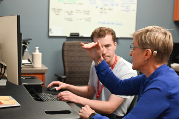 Lonie Salkowski discusses a case with Logan Murphy, her research intern.
