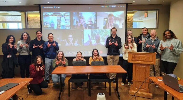 Dr. Grayev (pictured behind left chair) with residents, faculty and staff at the department’s education retreat in January 2025.