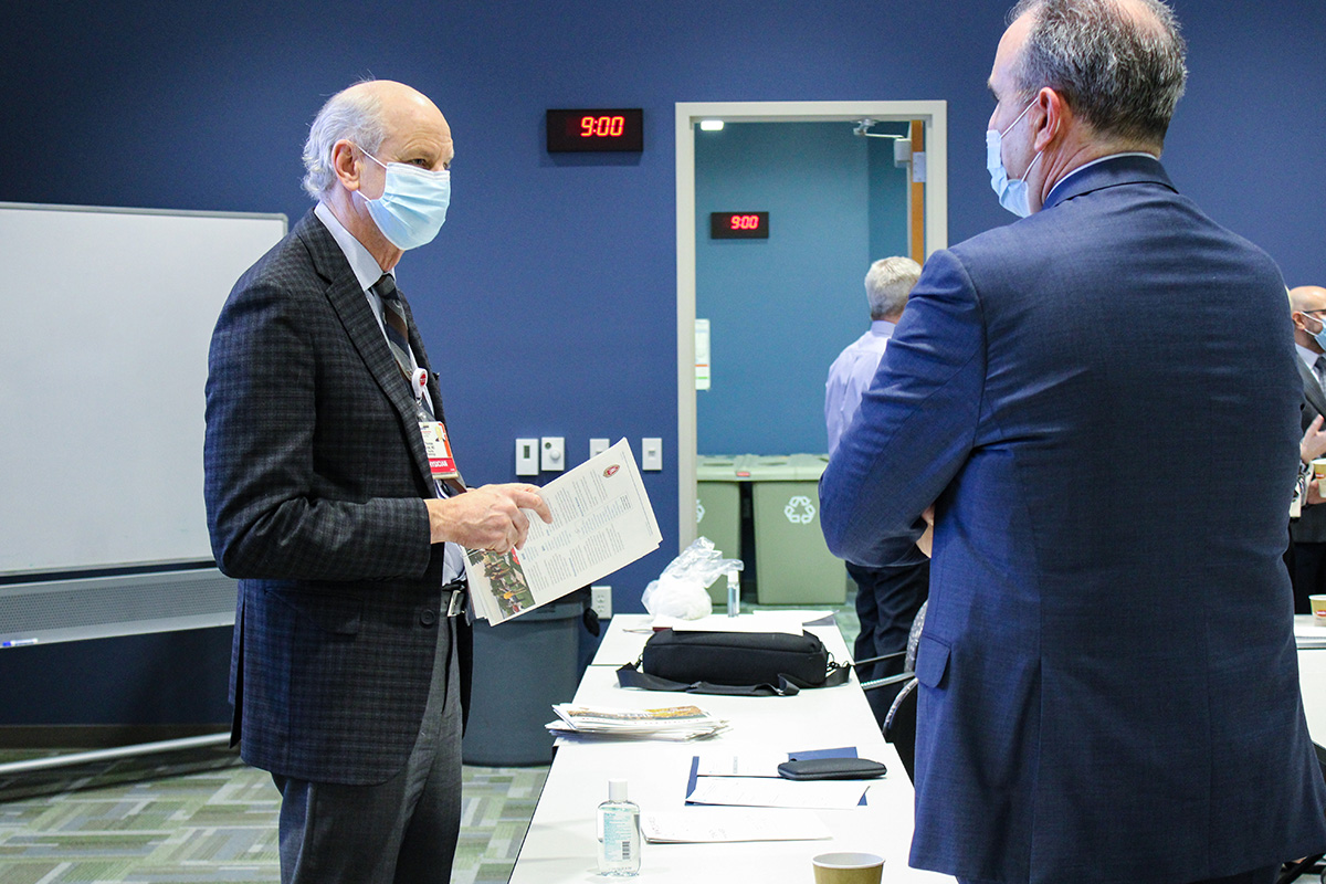 Caption: Thomas Grist, MD, Chair of the Department of Radiology, and Peter Arduini, new CEO & President of GE Healthcare, meet each other over coffee before the day’s schedule starts with introductory presentations.