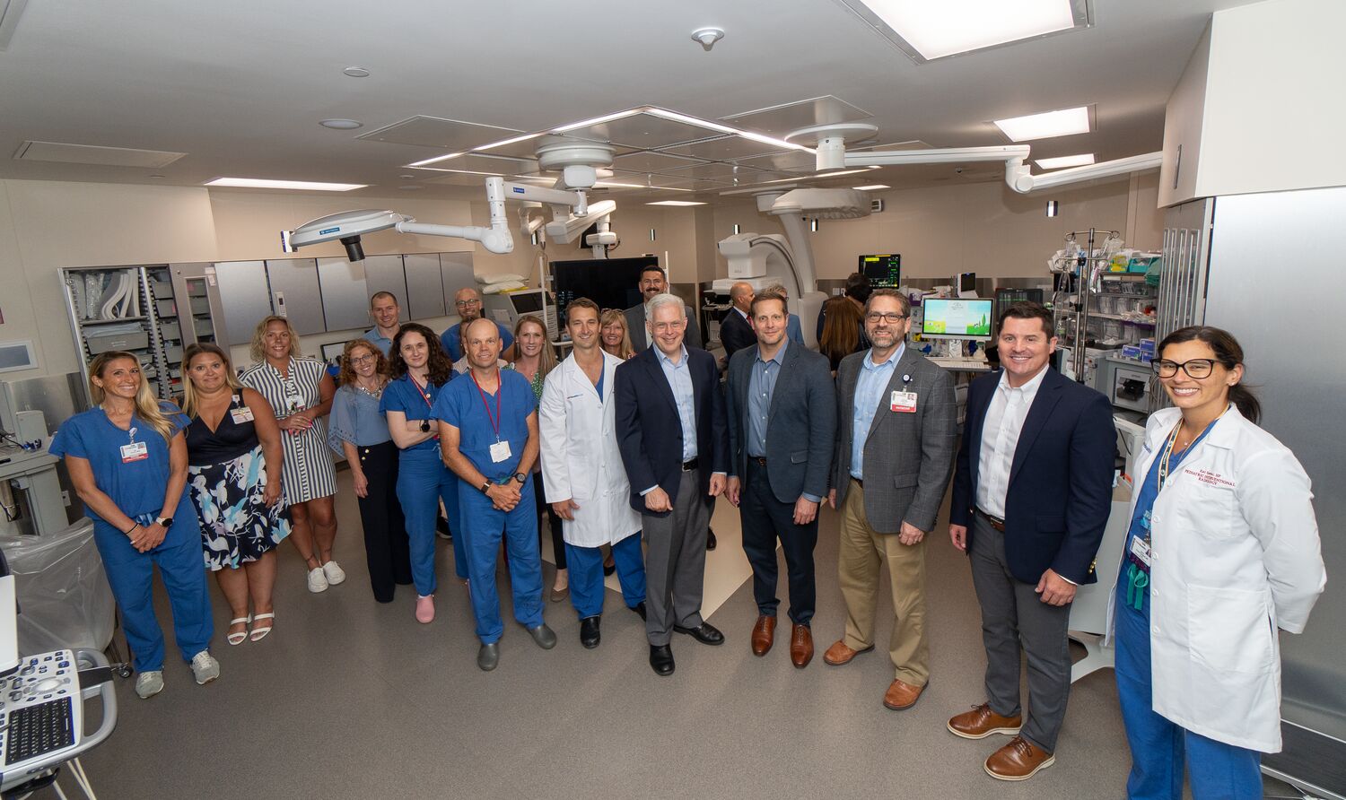 A group of people standing in the medical suite. 