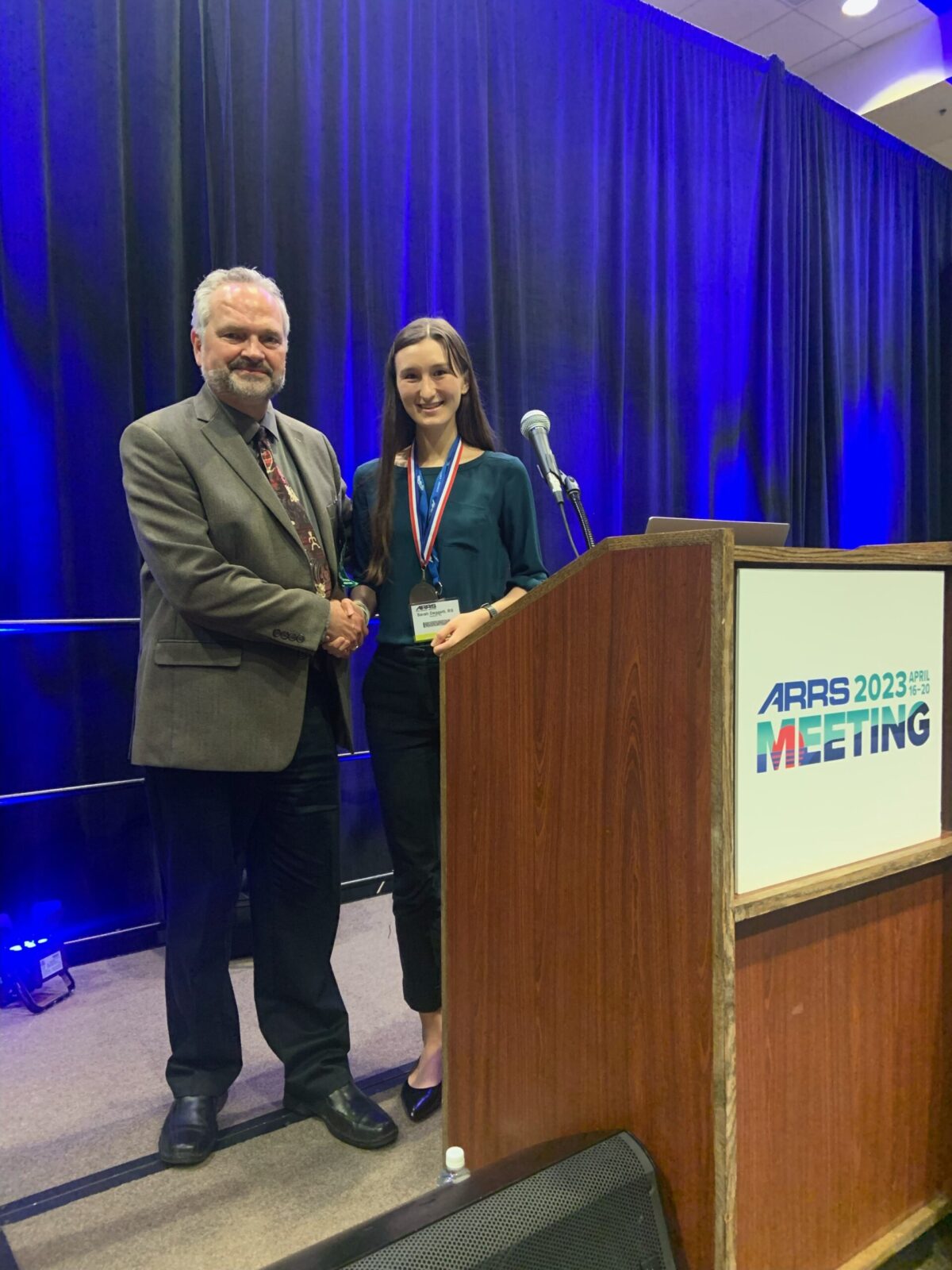 Daggett receiving the Emerging Research Silver Medal. (Photo courtesy of Meghan Lubner)