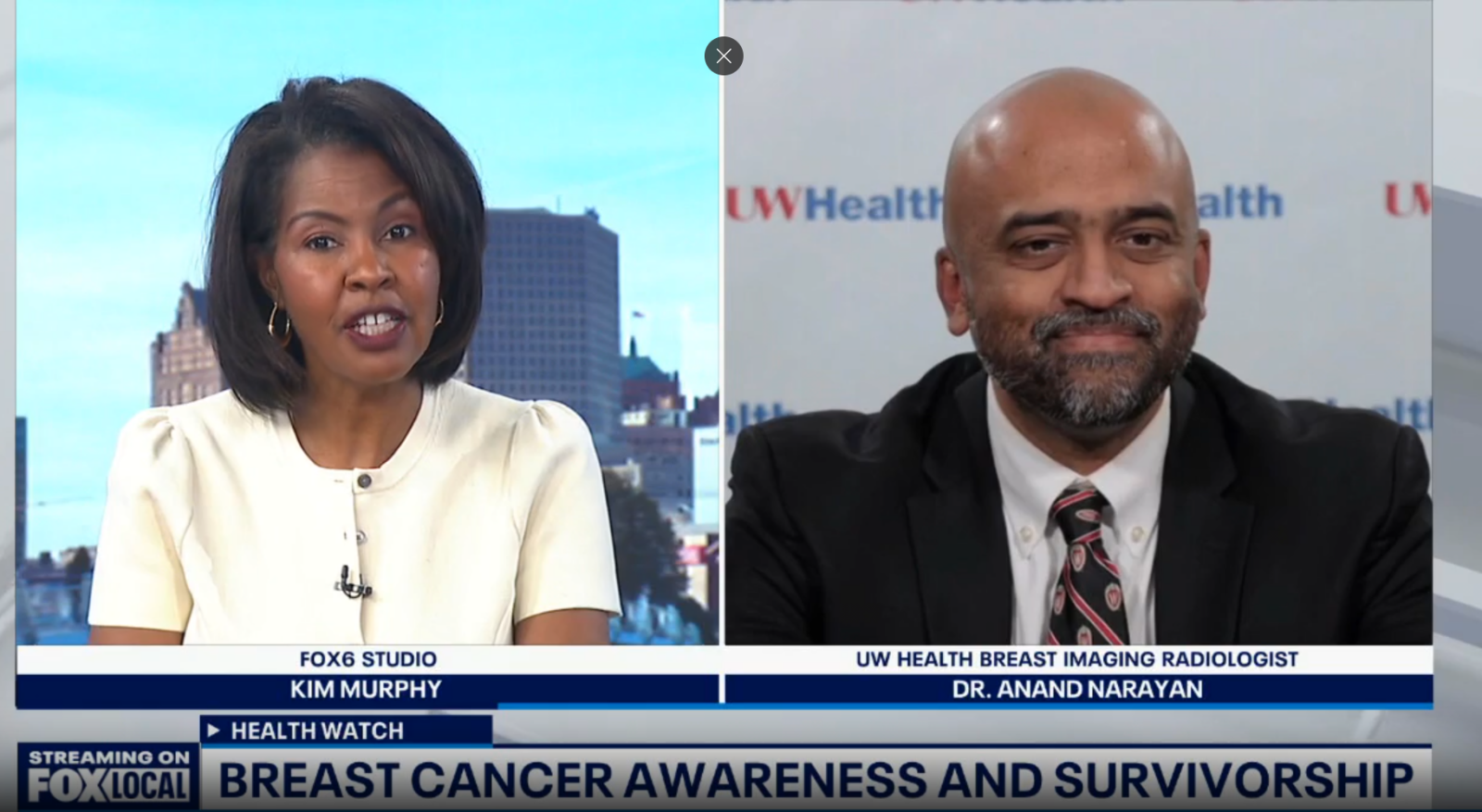 A screenshot from a news program. Two people are side by side on the screen.